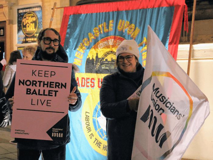 MU's Paul Gray and a member holding 'Keep Northern Ballet Live' plackard and MU flag. Photo by James Smith, TUC Northern