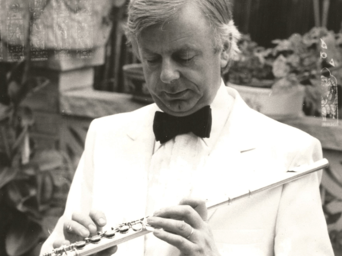 Black and white portrait of Christopher Hyde-Smith, holding his flute.
