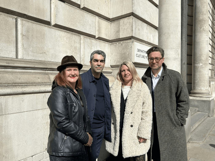 Naomi Pohl standing outside of Westminster with three other members of the Council of Music Makers.